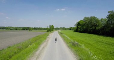 Young pretty woman walking in a forest lake towards the camera. High quality 4k footage