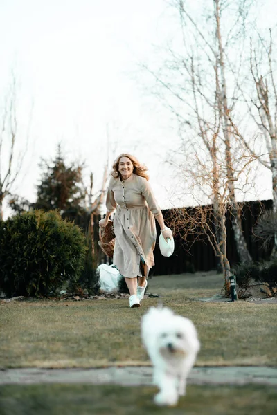 Happy Girl Blond Curly Hair Long Dress Runs Lawn Basket — 图库照片