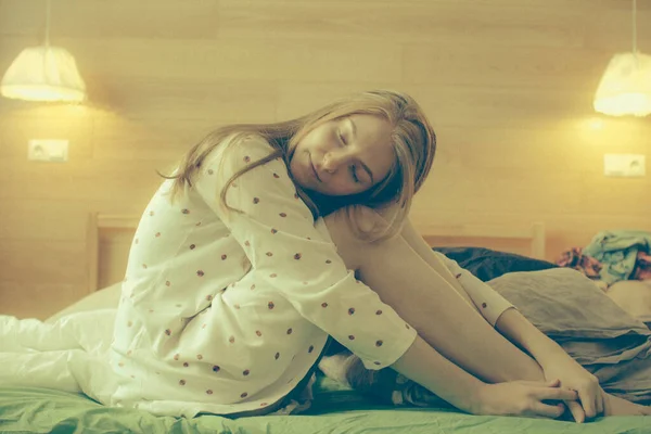 Sleepy Girl Red Hair White Pajamas Sits Bed Her Room — стоковое фото