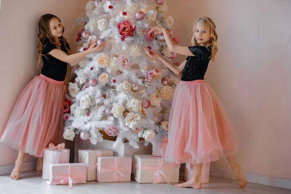 Two Little Girls Lush Pink Skirts Decorate Christmas Tree Child — Stock Photo, Image