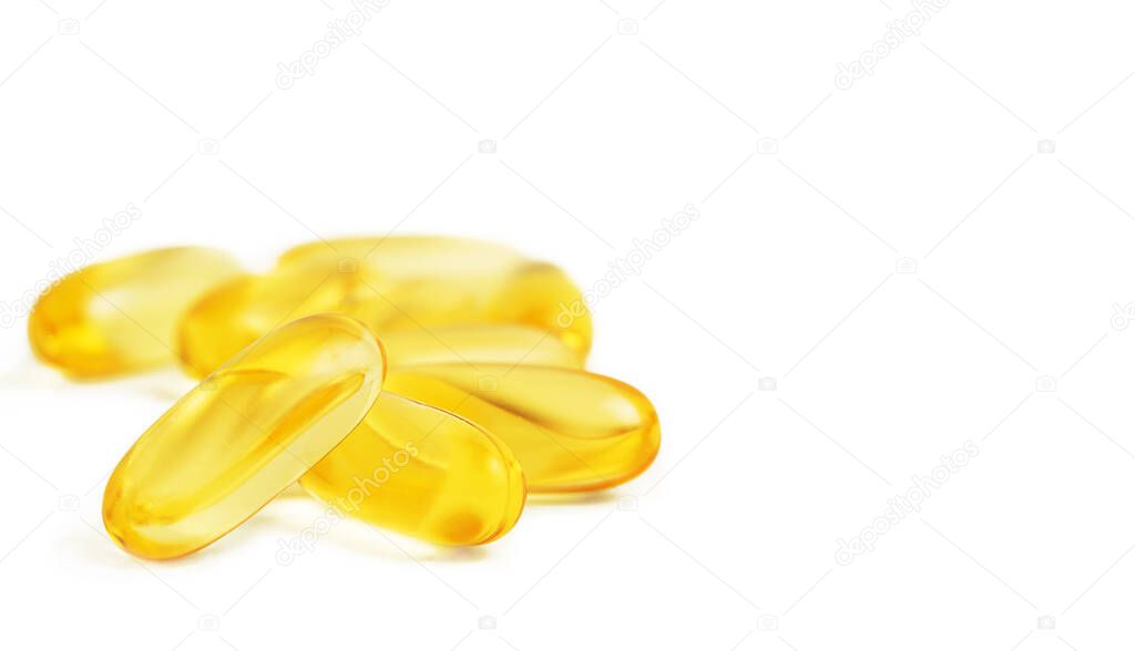 Heap of Omega 3 soft gel capsules isolated on white background. Copy space.