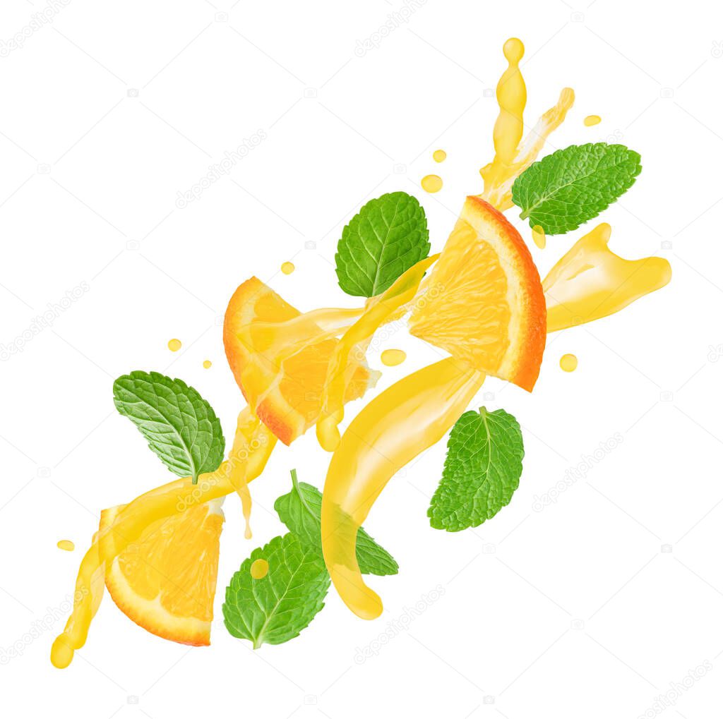 Orange slices with mint leaves flying with juice splashes isolated on white background.