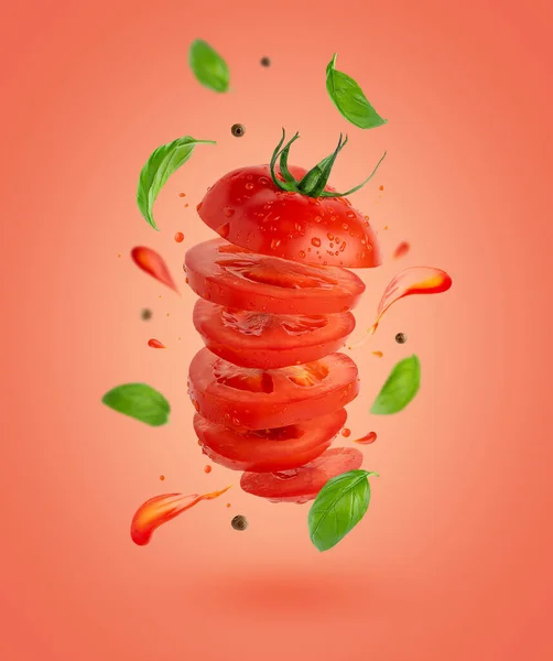 Flying Sliced Tomato Flowing Splashes Basil Leaves Red Background High — 图库照片
