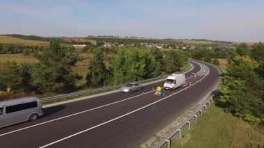 Road marking after road repair with workers. Aerial shot. High quality 4k footage