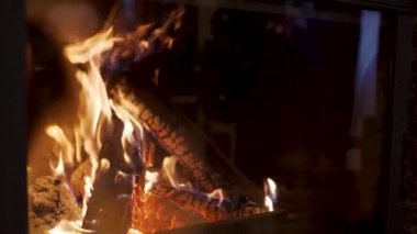 Woodstove fireplace. Satisfying burning fire in slowmotion 120 fps static shot. High quality FullHD footage
