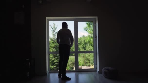 Man Puts Belt Backlight Man Standing Window Getting Dressed High — 비디오