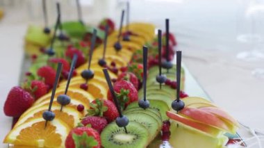 Prepared of fruit platter with various types fruits,melon,grape,peach. Dolly shot slow motion. High quality FullHD footage