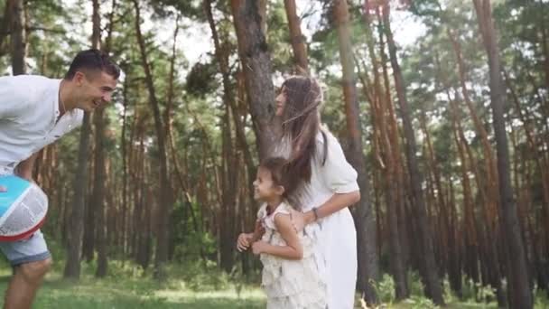 Parent Throws Child Mother Father Playing Kids Outdoors Pine Forest — 图库视频影像