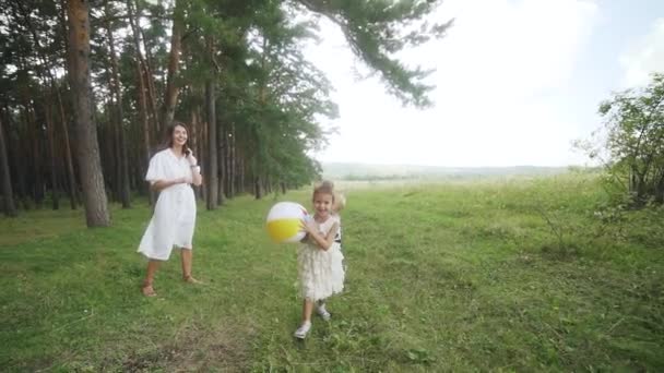 Wide Shot Camera Movement Running Happy Child Colourfull Ball Green — Stockvideo