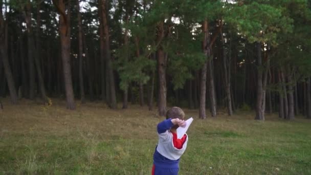Child Launching Paper Plane Outdoor Kid Playing Paper Plane Park — Video