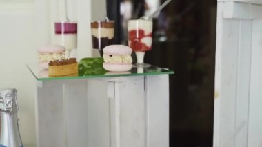 Close-up, a variety of delicious desserts, cakes with cream, chocolate, whipped cream, marshmallows, festive decor, sweet bar, corner, a treat. High quality FullHD footage
