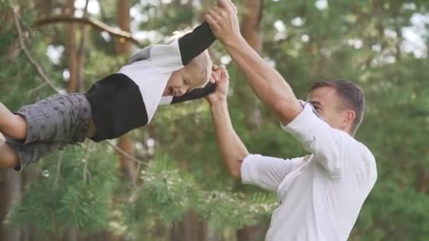 Happy Father Plays His Son Throws His Rotation Slow Motion — Stok video