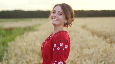 Slow-motion - Walking behind beauty girl in wheat field. Stopping and letting her go forward. High quality FullHD footage