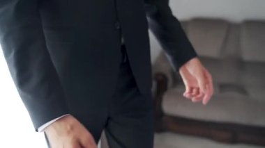wedding morning of the bride and groom in hotel room. High quality FullHD footage