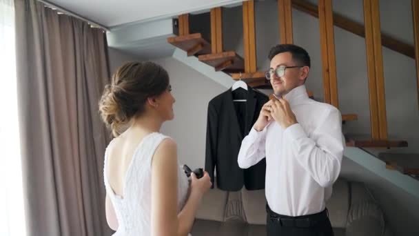 Bride Helps Groom Get Dressed Prepare Wedding Ceremony Young Couple — Stockvideo