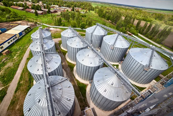 Metal elevator (grain silo) in agriculture zone. Grain Warehouse or depository is an important part of harvesting. orn, wheat and other crops are stored in  it