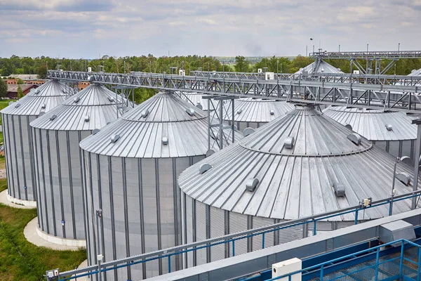 Metal elevator (grain silo) in agriculture zone. Grain Warehouse or depository is an important part of harvesting. orn, wheat and other crops are stored in  it