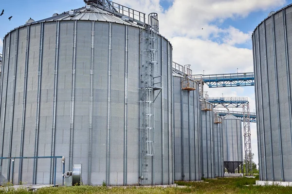 Metal elevator (grain silo) in agriculture zone. Grain Warehouse or depository is an important part of harvesting. orn, wheat and other crops are stored in  it