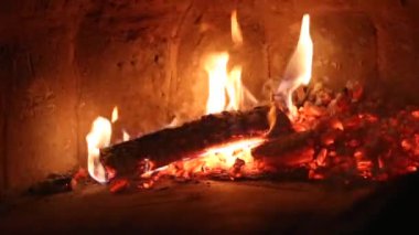 Slow burning wood in the fireplace. Autumn and winter holidays. Home comfort.
