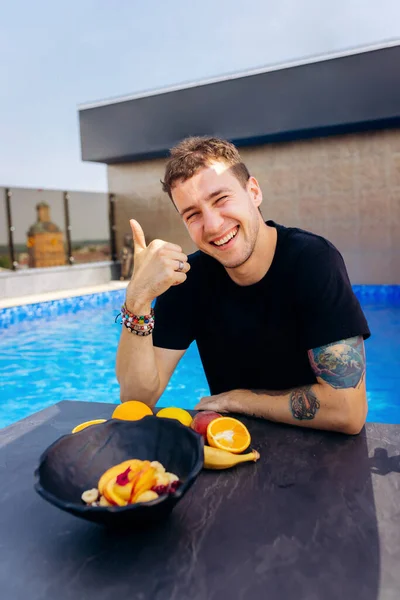 Cheerful Man Eat Sweet Oatmeal Fried Cheese Balls Peach Cranberries — Photo