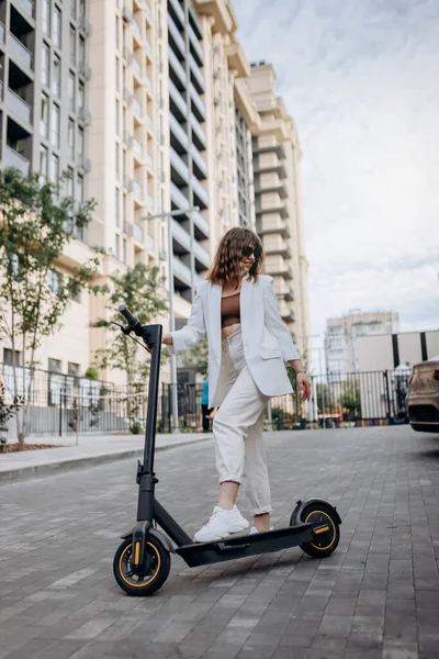 Beautiful Young Woman Sunglasses White Suit Standing Her Electric Scooter —  Fotos de Stock