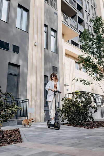 Beautiful Young Woman Sunglasses White Suit Riding Her Electric Scooter — 스톡 사진