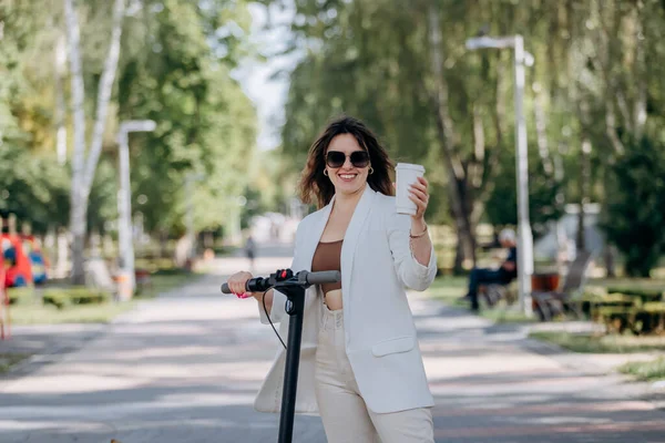 Beautiful Young Woman White Suit Sunglasses Standing Her Electric Scooter — Foto de Stock