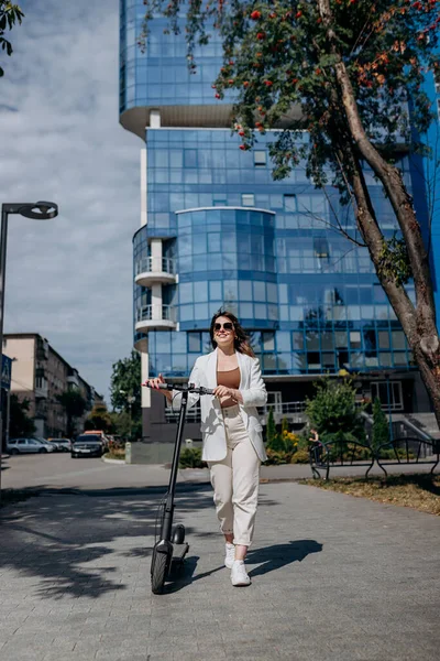 Beautiful Young Woman Sunglasses White Suit Standing Her Electric Scooter — Photo