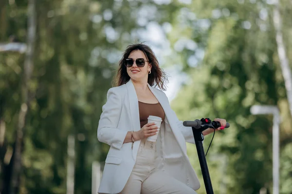 Beautiful Young Woman White Suit Sunglasses Standing Her Electric Scooter — Foto de Stock