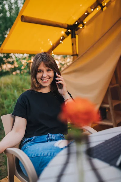 Happy Woman Freelancer Talking Phone Using Laptop Cozy Glamping Tent —  Fotos de Stock