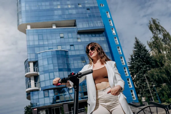 Beautiful Young Woman Sunglasses White Suit Standing Her Electric Scooter — Foto de Stock