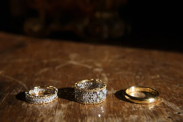 Three Wedding Ring Wooden Background — Stockfoto