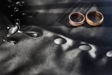 Three wedding ring on a black background.