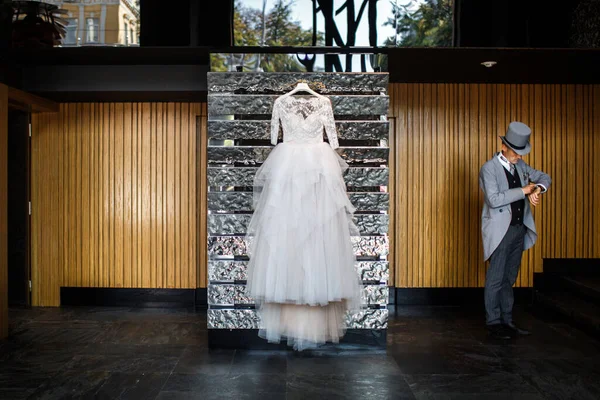 Wedding dress hanging on the wall in the hotel.