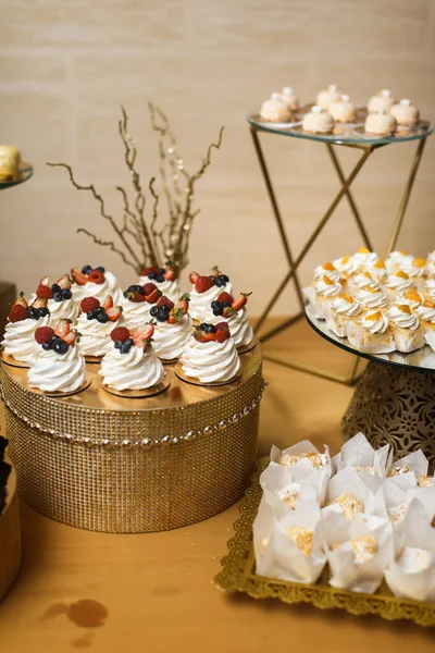 Rows of desserts on the wedding table.