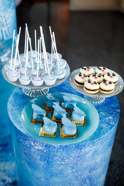 Rows of desserts on the birthday table. Ice concept