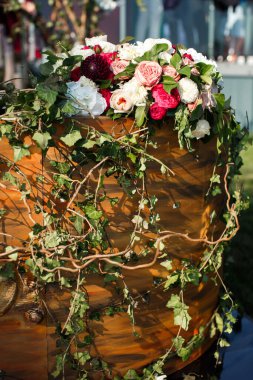 Bouquet of flowers in vase on the wedding table.