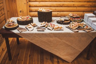 Rows of appetizers and starters on the wedding table.