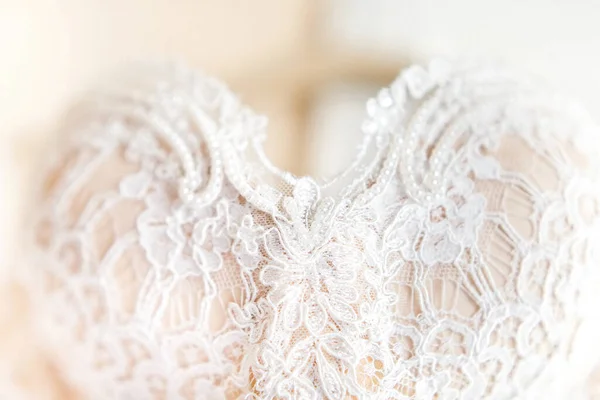 Beige wedding dress with lace. Details closeup.