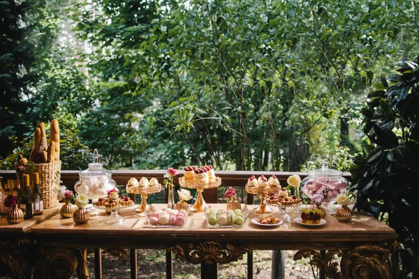 Rows of desserts on the wedding table.