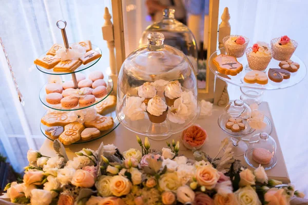 Rows of desserts on the wedding table.