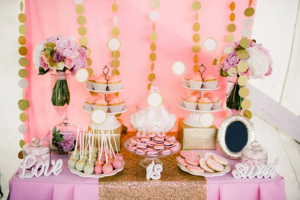 Rows of desserts on the wedding table.