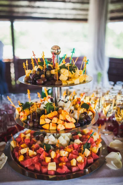 Multilevel fruit tray on a wedding table.