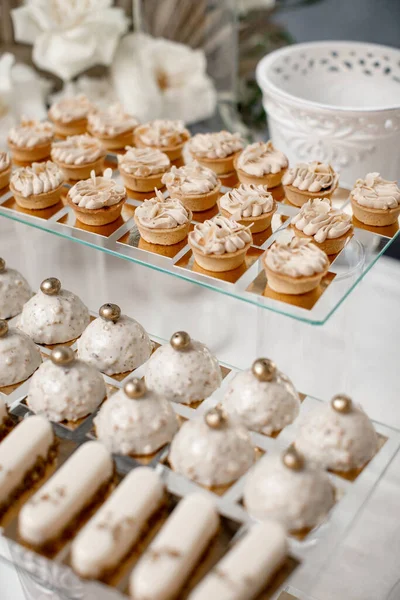 Rows of desserts on the wedding table.