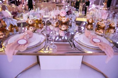 Decorated served table for wedding party or other event.