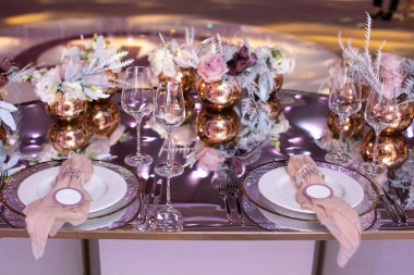 Decorated served table for wedding party or other event.