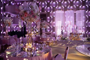 Decorated served tables for wedding party or other formal dinner.