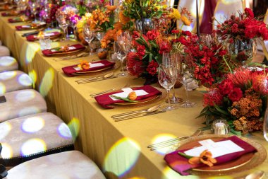 Decorated served table for wedding party or other event.