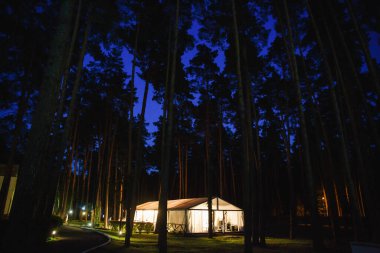Spacious tent on the sand for a wedding party.