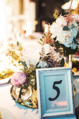 Sign showing table number at wedding party.